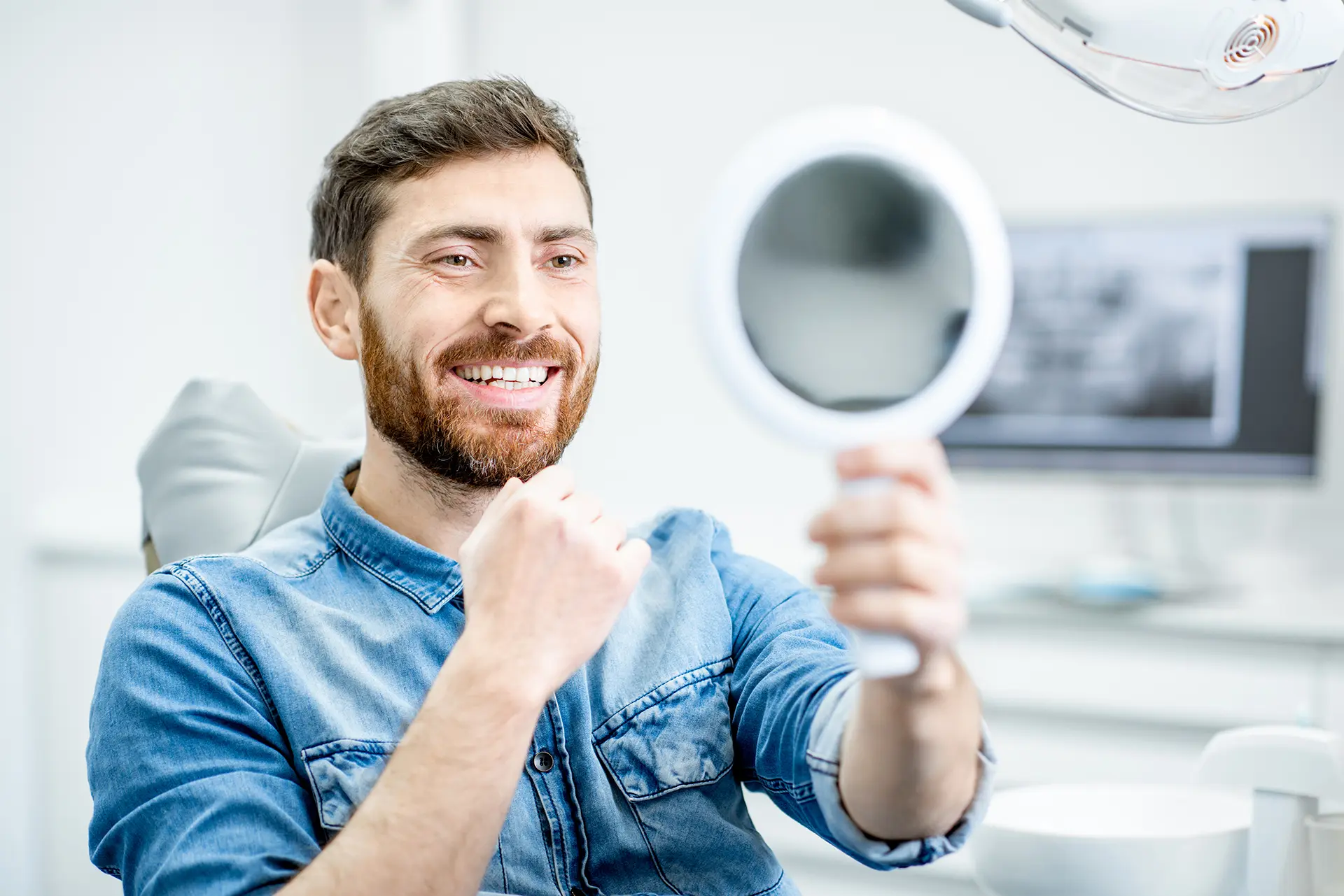 Man with a healthy smile at the dental office